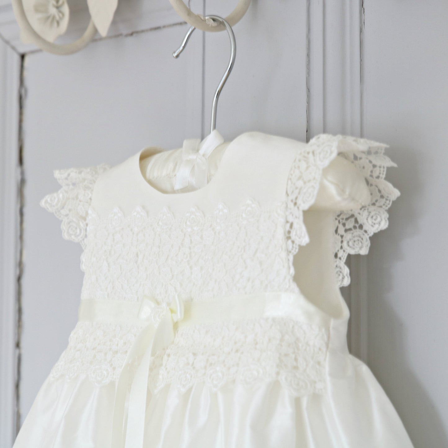 Close-up of the delicate Venice lace frill sleeves on the Rachel silk ceremony gown