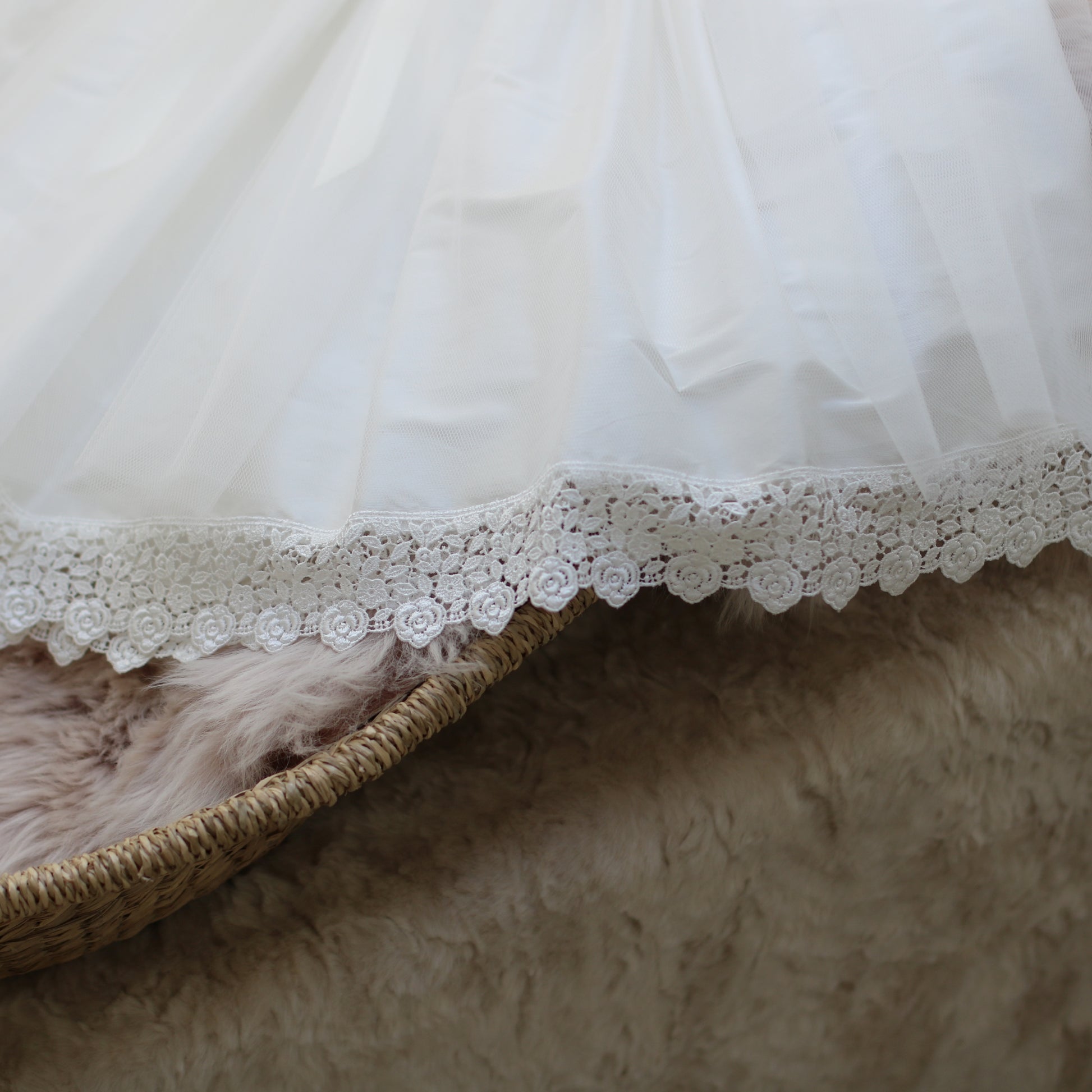 Close up image of the Evelyn dress hem showing the detail in the venice lace hem