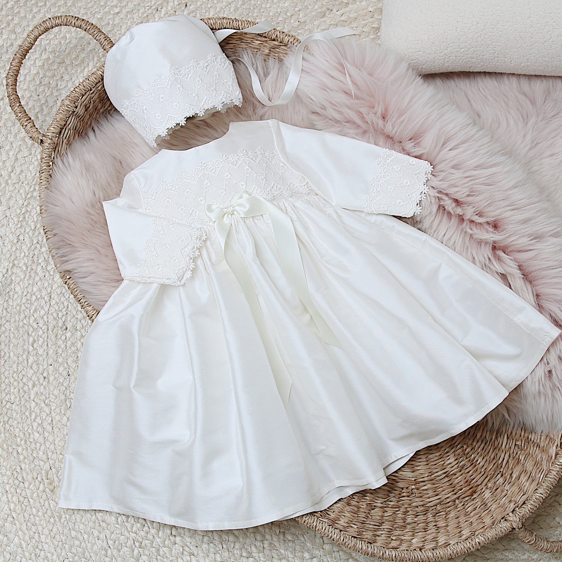 Lara silk and lace christening dress shown with the matching Lucy bonnet