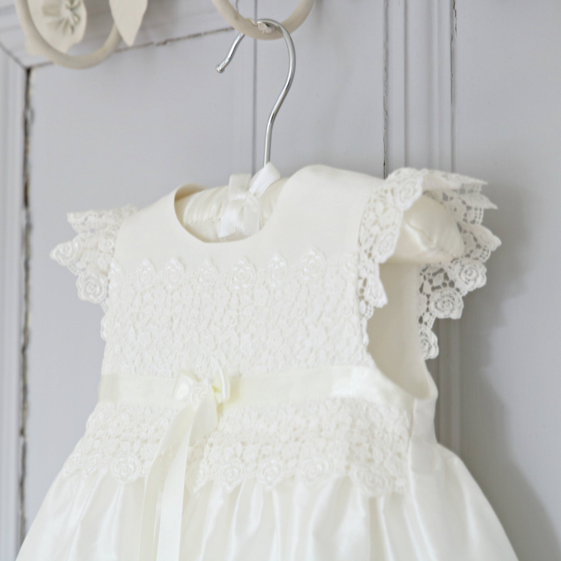 Close-up of the delicate Venice lace frill sleeves on the Rachel silk ceremony gown