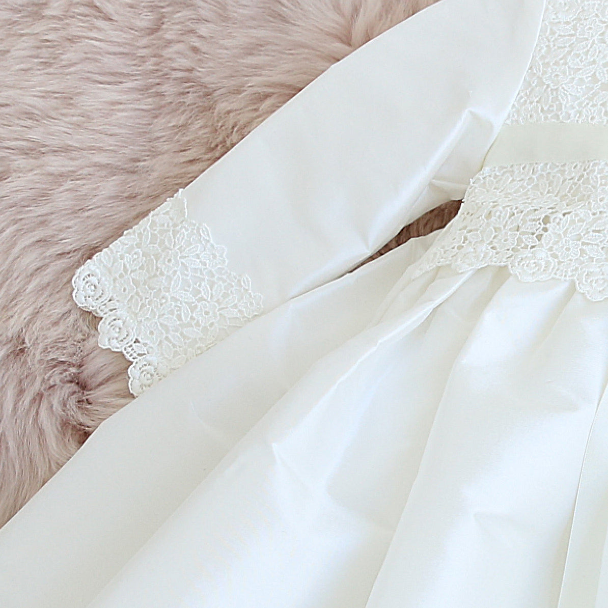 sleeve lace detail of the Rebekah christening gown showing details of the lace.