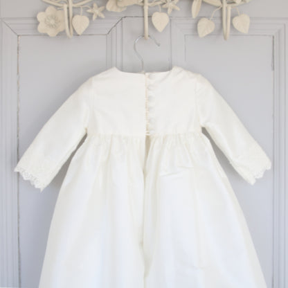 close up of the Rebekah christening gown back detail showing buttons and loops.