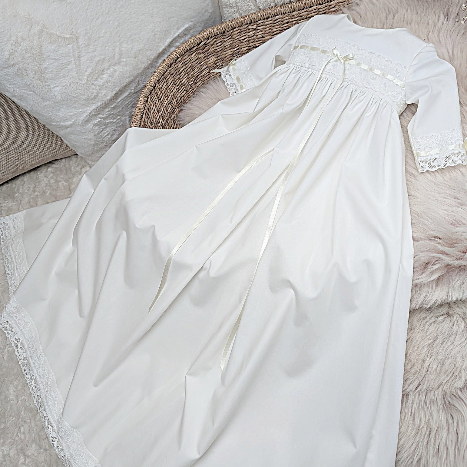 Vivienne ivory cotton baby gown showing the 3/4 length sleeves and detailed bodice