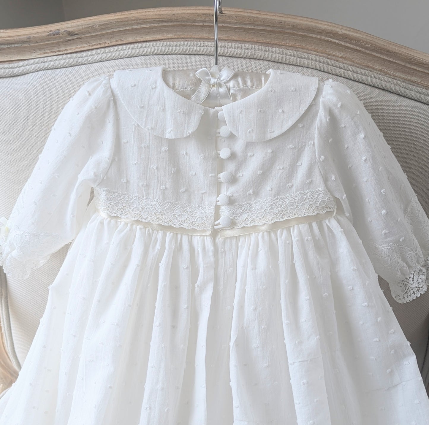 Close-up of the back bodice on the Isabella gown, featuring six signature fabric-covered buttons and delicate loop fastenings