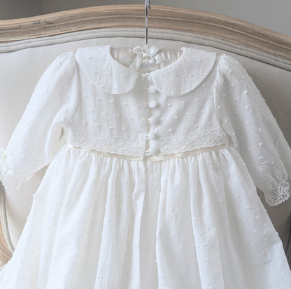 Close-up of the back bodice on the Isabella gown, featuring six signature fabric-covered buttons and delicate loop fastenings