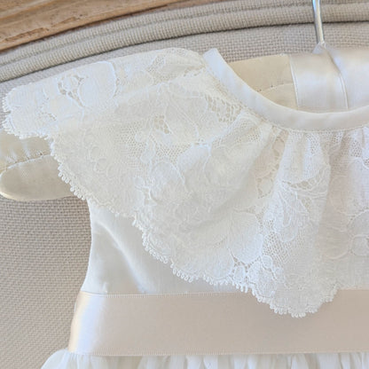 Close up of the frill style French lace collar on the sleeveless Eliana christening gown.
