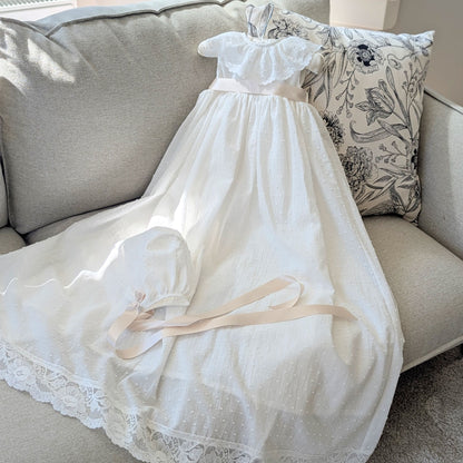 The complete Eliana christening set, featuring the long plumetti cotton gown and matching Swiss dot bonnet.