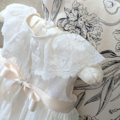 Close up of the frill style French lace collar on the back of the sleeveless Eliana christening gown.