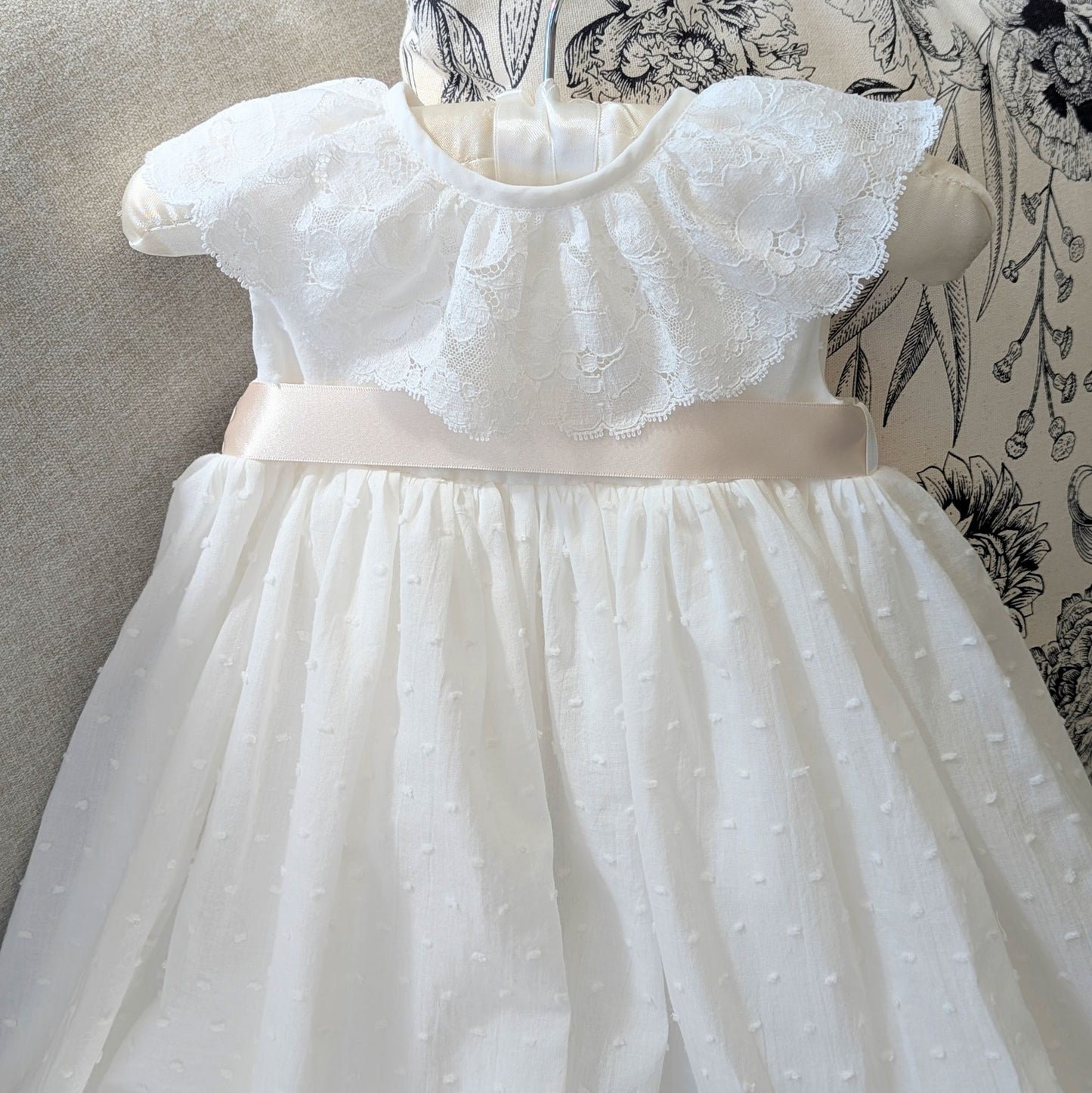 The front bodice and collar of the sleeveless Eliana christening gown, fully lined in cotton.