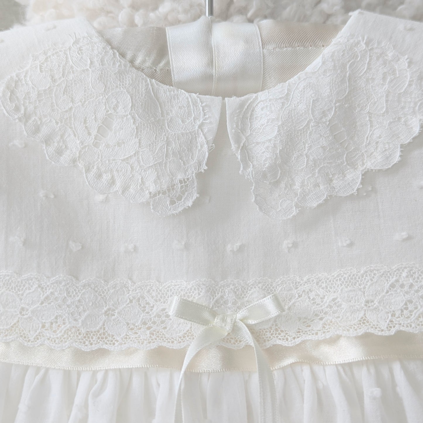 Intricate handmade couture details on the front bodice of the Mila and Moss Isabella gown.