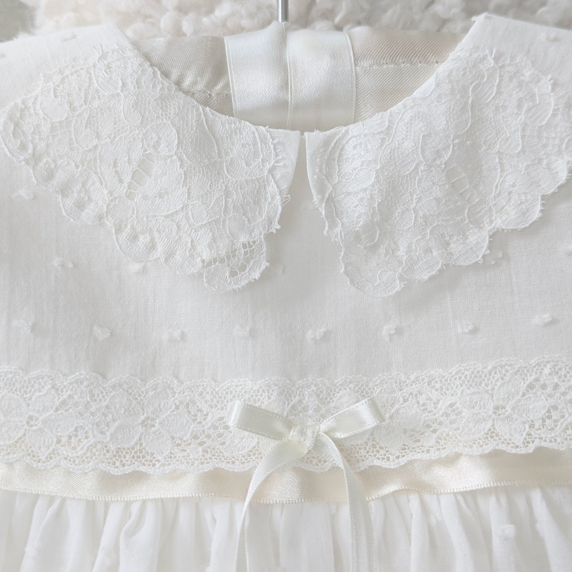 Intricate handmade couture details on the front bodice of the Mila and Moss Isabella gown.