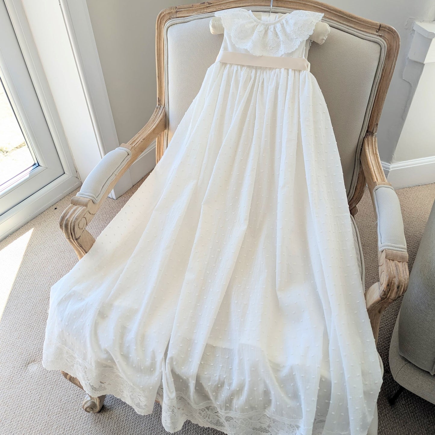 Full length front view of the ivory Eliana traditional christening gown made from plumetti cotton.